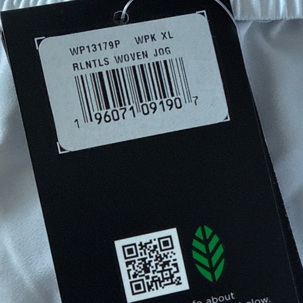 New Balance Relentless Woven Joggers Track Pants Athleisure White Streetwear New - Picture 4 of 8